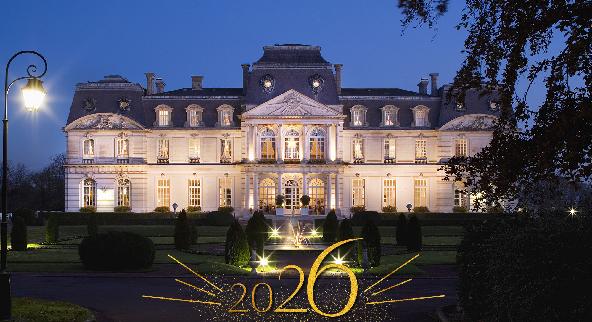 Illuminated mansion at night with 2026 decoration